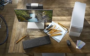 Dell desktops and monitors in a modern workspace, emphasizing professional-grade solutions for businesses.